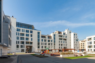 Fototapeta na wymiar several low-rise houses with children playground mixed-use urban multi-family residential district area development