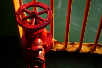Close up red water hydrant on a ferry. Safety over water