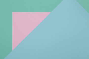 Obraz premium Blue, green and pink background, colored paper geometrically divides into zones, frame, copy, space.