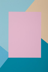 Blue, yellow and pink background, colored paper geometrically divides into zones, frame, copy, space.