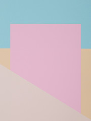 Blue, yellow and pink background, colored paper geometrically divides into zones, frame, copy, space.