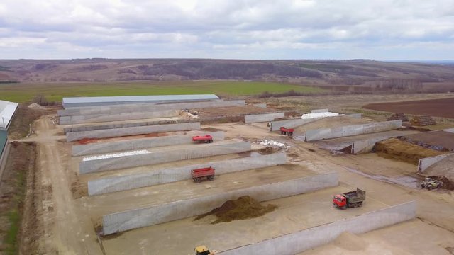 Preparation of feed for livestock at farm, aerial shot