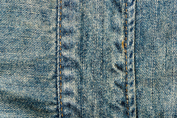 clothing items blue stonewashed faded jeans cotton fabric texture with seams, clasps, buttons and...