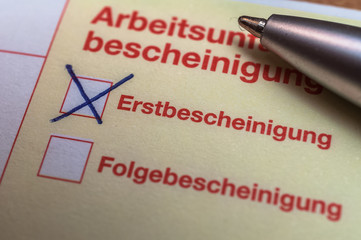 Fototapeta premium Krankenschein Erstbescheinigung