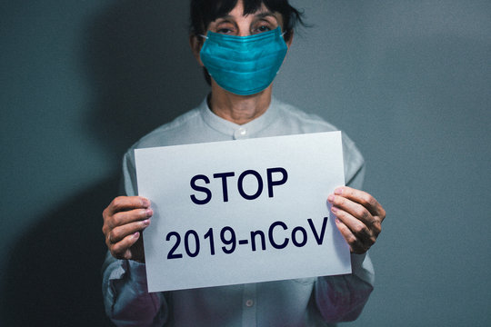 Coronavirus quarantine and Air pollution pm2.5 concept. Old sick woman wearing respirator mask for protect. Wuhan, China epidemic virus symptoms background, copy space.