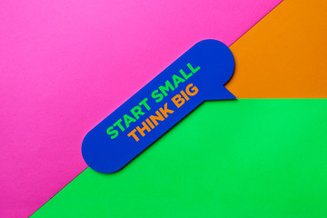 Start Small Think Big. Speech Bubble on Colored Background