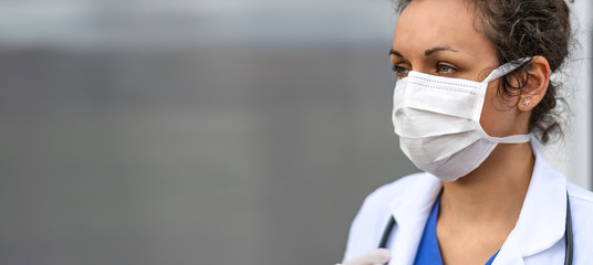 Biology and science. Doctor wearing protection face mask. Virus or bacteria cells. Global alert. Epidemic flu. Coronavirus. Medical staff preventive gear.