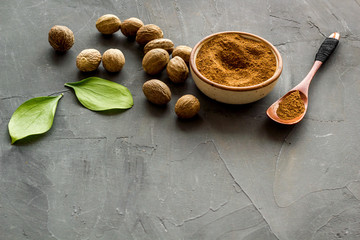 Nutmeg - still life with asian spices - on grey background copy space