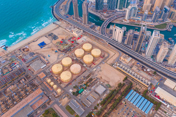 Aerial view of petrochemical oil refinery and sea in industrial engineering and energy concept in...