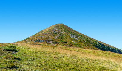 Photo of green Hoverla mountain peak in Carpathians at summer day
