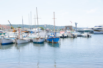 Fototapeta na wymiar Saint-Tropez marine, with tourists sightseeing in summer