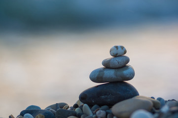 stack of zen stones on pebble beach