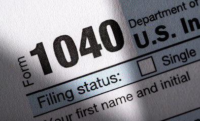 A stack of United States tax forms for individuals.  - 329400022