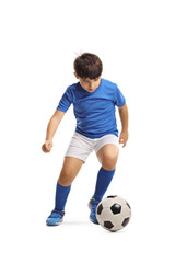 Boy in a sports jersey running with a football