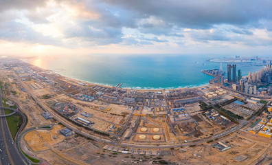 Aerial view of petrochemical oil refinery and sea in industrial engineering and energy concept in...