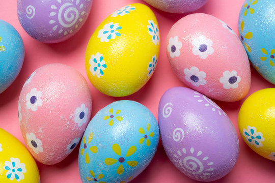 Painted Easter eggs on a colorful background