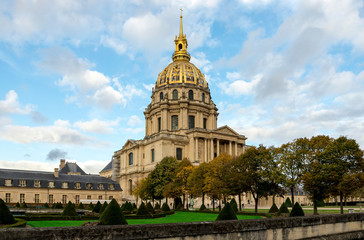 Fototapeta na wymiar A scenic view of the Church of the Hotel des Invalides and landscaped garden from Avenue de Tourville, Paris, France