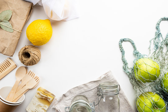 Zero Waste Concept. Eco-friendly Kitchen And Bath Set. Brushes, Soap, Textile Bags, Glass Jars, Wooden Cutlery And Plant, Top View Copy Space