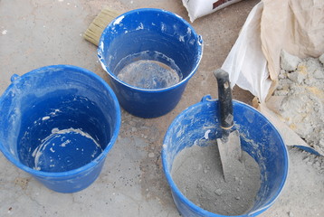 Blue Buckets and Cement Mix