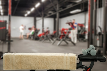 Gym interior and black bench. Dumbbells composition and free space for your decoration. 