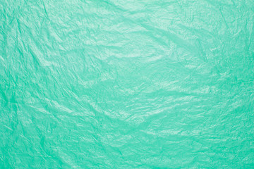 Turquoise plastic bag texture background. Abstract green background.
