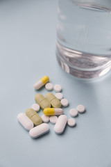 pills scattered on a blue background