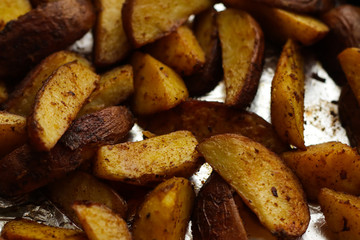 Tasty roasted potato slices , close up