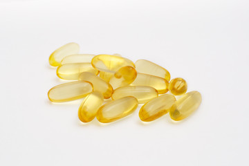 healthy food. Close up of capsules Omega 3 on white background Copy space Top view, high resolution product. Health care concept Capsules of cod liver oil arranged on white background Fish oil vitamin