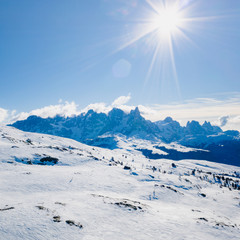 Sunny winter landscape at Ski Area in Dolomites, Italy - Alpe Lusia. Ski resort in val di Fassa near Moena
