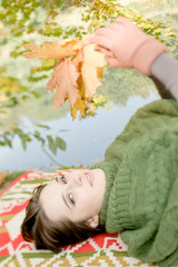 Young woman enjoying autumn atmosphere