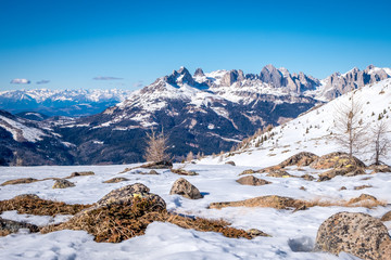 Fototapeta premium Sunny winter landscape at Ski Area in Dolomites, Italy - Alpe Lusia. Ski resort in val di Fassa near Moena