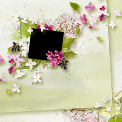 Spring scrapbook frame for photo with purple lilac on green background. Spring blossom mood. Decorative frame in scrapbook style with lilac flowers. Romantic theme. Spring, summer and flowers theme