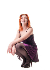 Naklejka premium young woman in tight black dress on white background