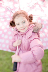 Little girl with polka dots umbrella