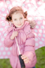 Little girl with polka dots umbrella