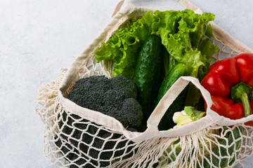 Mesh bag with vegetables. Zero waste and health vegan and vegetarian food concept. Copy space