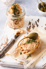Sandwich with chicken pate with caper on a light board background. Selective focus