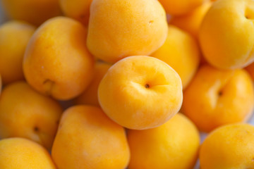 Ripe apricots close-up background