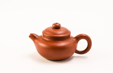 A red clay pot on a white background
