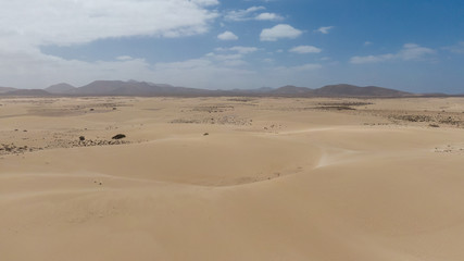 Fototapeta na wymiar Aerial view on Sand Dunes In Corralejo, Fuerteventura Spain 