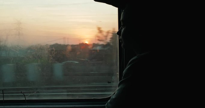 Enjoying travel. Young pretty woman traveling by the indian train first class near the window. young Lady Traveling Commute Train Concept.