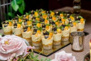 Delicious Dessert table for a Wedding or Party. Cupcakes, sweets, mock-tails and juices