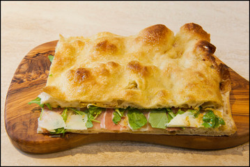 Roman stuffed focaccia sandwich with cold cuts, cheese and various vegetables