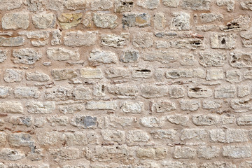 Rough brickwork on clay mortar.
