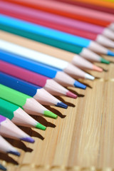 Colored Pencils On A Wooden Background