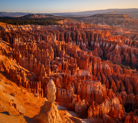 Inspiration Point during beautiful sunrise, with hoodoos - unique rock formations from sandstone...