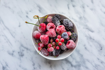Frozen berries in a bowl. Raspberries, blueberries, blueberries, currants, mulberries, freezing cherries. Assorted berries. Proper nutrition. Healthy nutrition. Vegetarian food. Vegan food. Delicious 