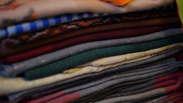 Colorful textile fabrics for sale at Dilli Haat New Delhi India, a market filled with colorful handicrafts and handmade items