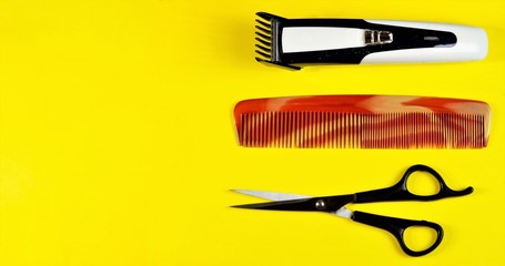 Hairdressing supplies background. Scissors, comb, clipper. Hairdressing services for hair care - cutting, Curling, creating hairstyles, coloring, highlighting, shaving, cutting beards and mustaches.