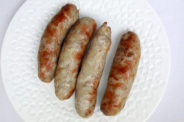 Fried sausages on plate